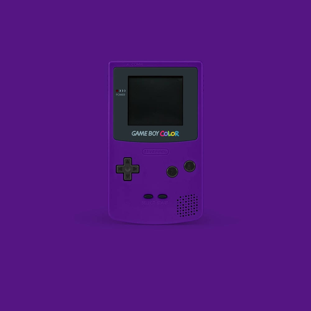 کنسول دستی بنفش قدیمی Game Boy Color والپیپر